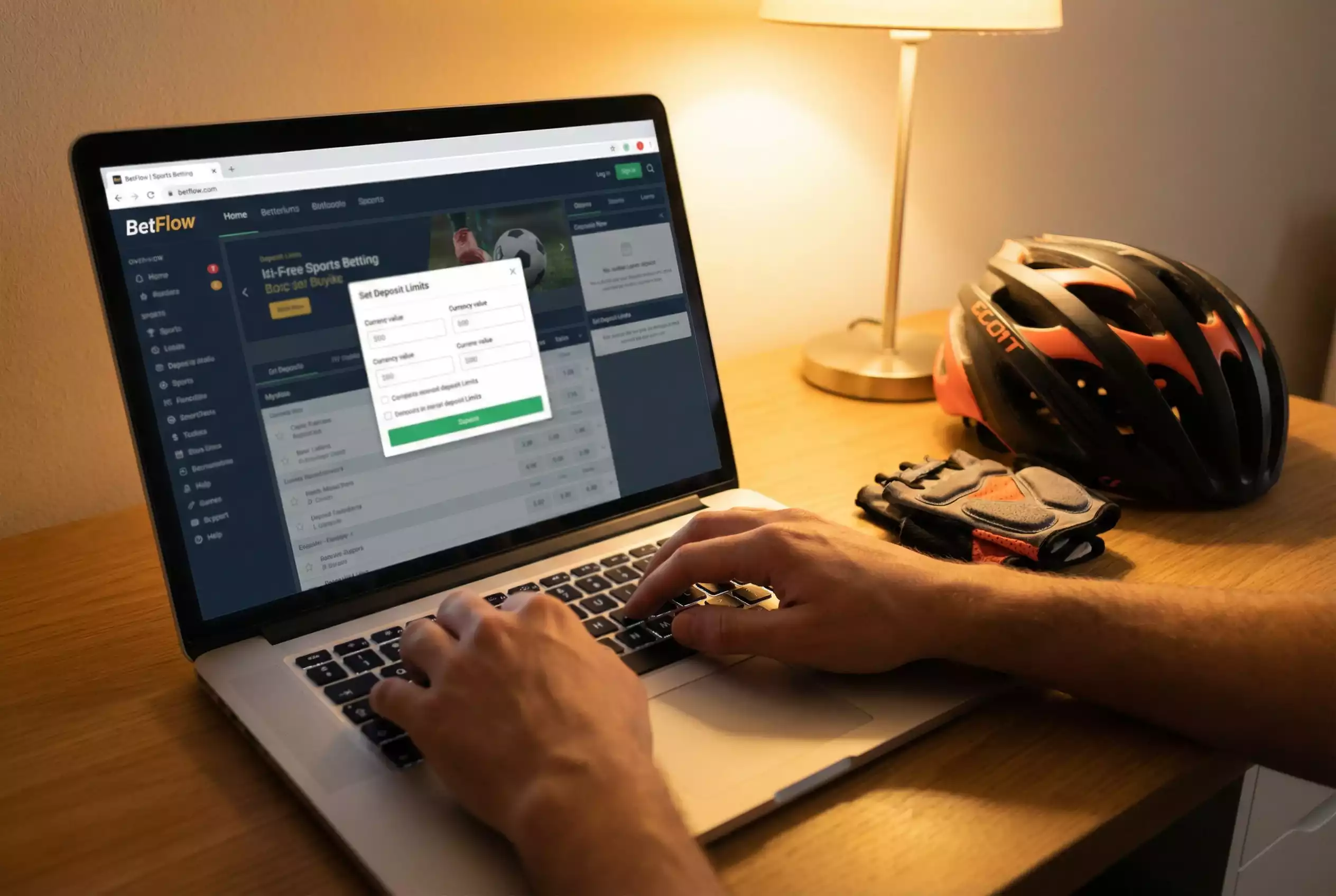 Mano che imposta limiti di deposito su schermata di piattaforma scommesse con simboli di ciclismo